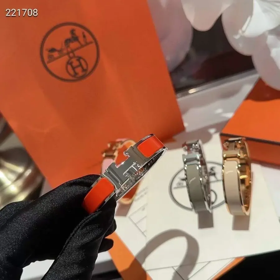 Hermès Clic H Mini Bracelet in Orange Enamel with Palladium Hardware — listing photograph