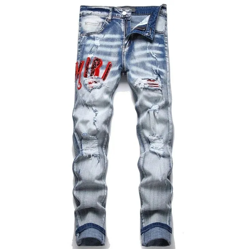 Amiri Distressed Ripped Denim Jeans with Red Logo Embroidery — listing photograph