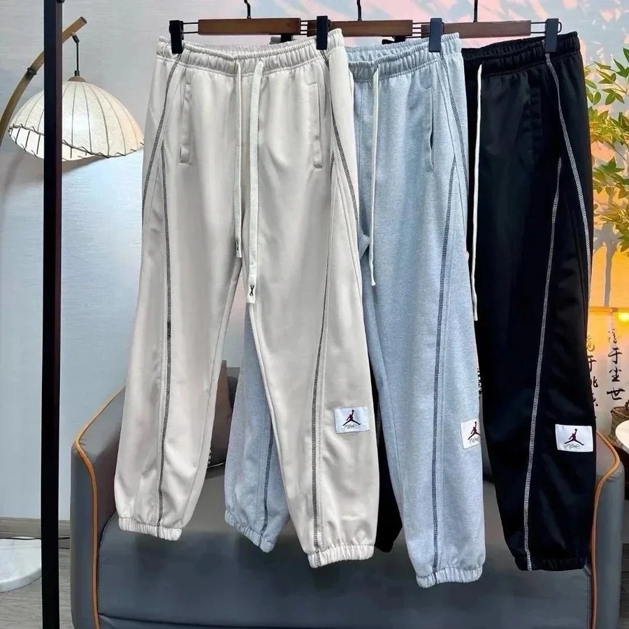 Jordan Brand Track Pants - Beige, Gray, Black with Side Stripe & Logo Patch — listing photograph