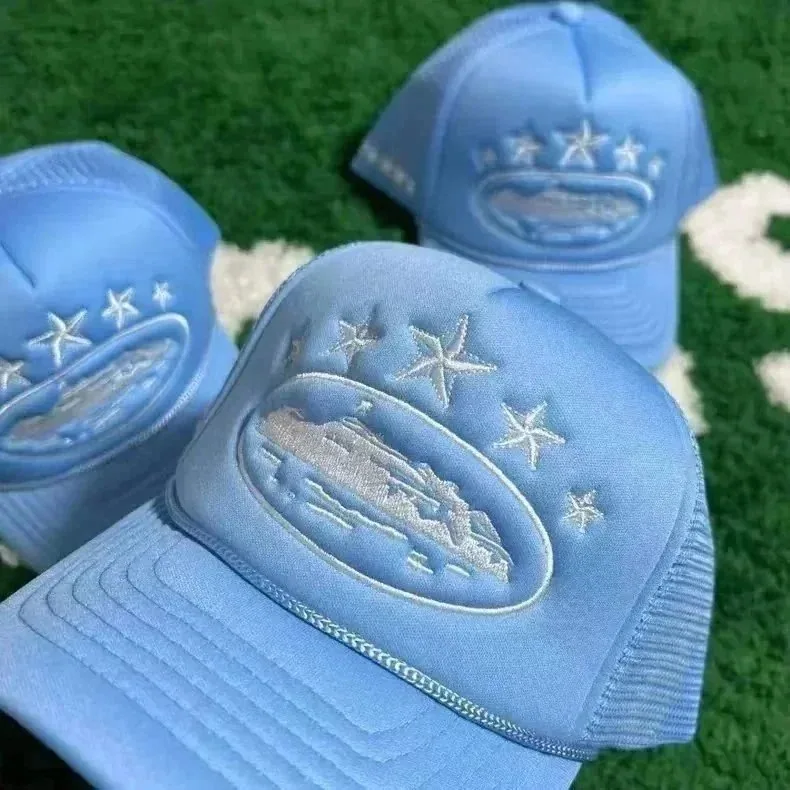 Light Blue Trucker Hat with Embroidered Mountain and Star Design — listing photograph